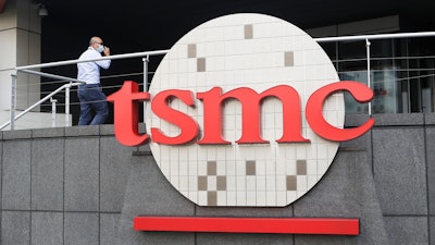 A person walks into the Taiwan Semiconductor Manufacturing Co., Ltd. (TSMC) headquarters in Hsinchu, Taiwan on Oct. 20, 2021.