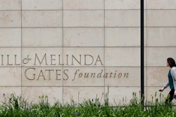A person walks by the headquarters of the Bill and Melinda Gates Foundation on April 27, 2018, in Seattle.