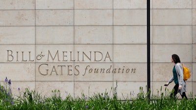 A person walks by the headquarters of the Bill and Melinda Gates Foundation on April 27, 2018, in Seattle.
