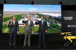 Chung Eui-sun, left, executive chairman of Hyundai Motor Group, Georgia Gov. Brian Kemp, and Jose Munoz, president and COO of Hyundai, celebrate with a champagne toast during the official groundbreaking for the Hyundai Meta Plant on Tuesday, Oct. 25, 2022 in Ellabell, Ga.