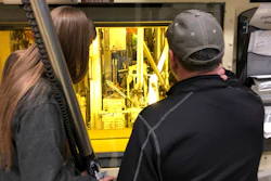 Hot cell operators Dawnette Hunter, left, and Scot White manipulate radioactive material from behind 4-foot-thick leaded glass at the Hot Fuel Examination Facility at the Idaho National Laboratory, about 50 miles west of Idaho Falls, Idaho, on Nov. 29, 2018.