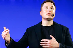 Tesla Motors, Inc. CEO Elon Musk speaks at the Paris Pantheon Sorbonne University as part of the COP21, United Nations Climate Change Conference in Paris on Dec. 2, 2015. An early prototype of Tesla Inc.'s proposed Optimus humanoid robot slowly and awkwardly walked onto a stage, turned, and waved to a cheering crowd at the company's artificial intelligence event Friday, Sept. 30, 2022.