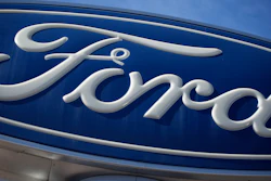 This Oct. 24, 2021 file photo shows a Ford company logo on a sign at a Ford dealership in southeast Denver.