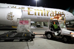 A shipment is offloaded from an Emirates Airlines Boing 777 at the Dubai International Airport in Dubai, United Arab Emirates on Feb. 21, 2021.