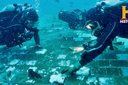 In this photo provided by the HISTORY® Channel, underwater explorer and marine biologist Mike Barnette and wreck diver Jimmy Gadomski explore a 20-foot segment of the 1986 Space Shuttle Challenger that the team discovered in the waters off the coast of Florida during the filming of The HISTORY® Channel’s new series, “The Bermuda Triangle: Into Cursed Waters,” premiering Tuesday, Nov. 22, 2022.