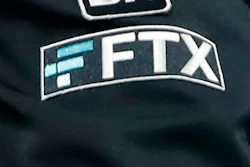 The FTX logo appears on home plate umpire Jansen Visconti's jacket at a baseball game with the Minnesota Twins on Tuesday, Sept. 27, 2022, in Minneapolis.