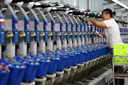 A woman works in a textile factory in Human in eastern China's Shandong Province, Nov. 1, 2022.