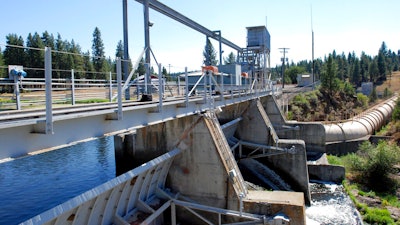 The J.C. Boyle Dam diverts water from the Klamath River to a powerhouse downstream on Aug. 21, 2009, in Keno, Ore. Plans for the largest dam demolition project in U.S. history to save imperiled salmon could soon become reality, with the first stages of construction starting in California as early as this summer. The Federal Energy Regulatory Commission meets Thursday, Nov. 17, 2022, and is expected to vote on whether to approve the surrender of PacificCorp's hydroelectric license for four dams on the lower Klamath River in remote northern California.