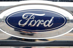 In this Oct. 20, 2019 file photograph, the company logo shines off the grille of an unsold vehicle at a Ford dealership in Littleton, Colo. Ford is recalling over 634,000 SUVs worldwide, Thursday, Nov. 24, 2022, because a cracked fuel injector can spill fuel or leak vapors onto a hot engine and cause fires. The recall covers Bronco Sport and Escape SUVs from the 2020 through 2023 model years with 1.5-liter, three-cylinder engines.