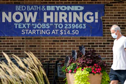 A hiring sign is displayed in Deerfield, Ill., Wednesday, Sept. 21, 2022. On Tuesday the Labor Department reports on job openings and labor turnover for September. U.S. job openings rose unexpectedly in September 2022, suggesting that the American labor market is not cooling as fast as the inflation fighters at the Federal Reserve hoped. Employers posted 10.7 million job vacancies in September, up from 10.2 million in August, the Labor Department said Tuesday. Economists had expected the number of job openings to drop below 10 million.