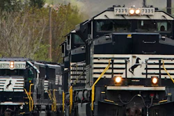 A Norfolk Southern freight train approaches a crossing in Homestead, Pa., April 27, 2022.