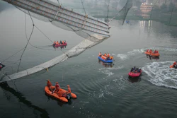 Search and rescue work is going on as a cable suspension bridge collapsed in Morbi town of western state Gujarat, India, Monday, Oct. 31, 2022.