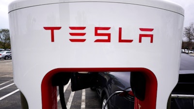 Tesla Supercharger is seen at Willow Festival shopping plaza parking lot in Northbrook, Ill., on May 5, 2022.