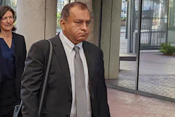 Ramesh 'Sunny' Balwani, right, the former lover and business partner of Theranos CEO Elizabeth Holmes, walks into federal court in San Jose, Calif., on June 24, 2022.