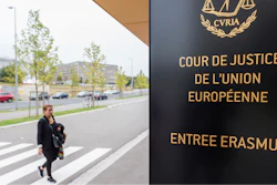 In this photo taken on Oct. 5, 2015 a woman walks by the entrance to the European Court of Justice in Luxembourg.