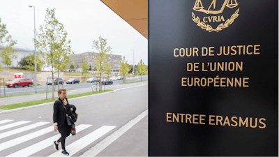 In this photo taken on Oct. 5, 2015 a woman walks by the entrance to the European Court of Justice in Luxembourg.