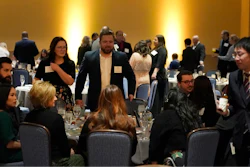 Employees and their guests attend the holiday dinner and karaoke party for Ajinomoto Health and Nutrition North America employees Friday, Dec. 9, 2022, in Schaumburg, Ill. Say goodbye to virtual wine tasting, and practice your karaoke. Company holiday parties are making a comeback. After more than two years of working in pajama bottoms and clinking glasses over Zoom, many office workers are yearning for a bit of glamour, or at least a sense of normalcy.