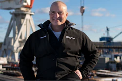 Charles F. Krugh, president of Bath Iron Works, poses at the shipyard Tuesday, Dec. 20, 2022, in Bath, Maine. The former Gulfstream Areospace executive and U.S. Army veteran oversees a workforce that builds destroyers for the Navy.