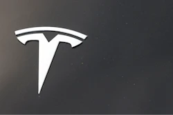 The Tesla company logo is seen on the hood of an unsold vehicle at a dealership, Aug. 9, 2020, in Littleton, Colo.