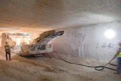 This undated file image provided by the U.S. Department of Energy shows an electric continuous miner machine run by Randy Wilson, left, and Blas Castaneda, chewing through a wall of salt during the excavation of Panel 8 at the Waste Isolation Pilot Plant near Carlsbad, N.M. On Thursday, Dec. 8, 2022, New Mexico officials outlined new conditions for a proposed permit for the U.S. government to continue disposing of nuclear waste in the southeast corner of the state as part of a multibillion-dollar federal cleanup program.