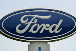 A Ford logo is seen on signage at Country Ford in Graham, N.C., on July 27, 2021.