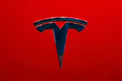 The logo of Tesla model 3 is seen at the Auto show on Oct. 3, 2018, in Paris.
