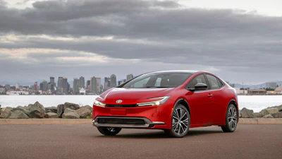 This photo provided by Toyota shows the 2023 Toyota Prius, a compact hybrid hatchback that has been redesigned with better looks and better fuel economy.
