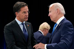 Netherland's Prime Minister Mark Rutte, left, speaks with U.S. President Joe Biden during a round table meeting at a NATO summit in Madrid, Spain, June 29, 2022.