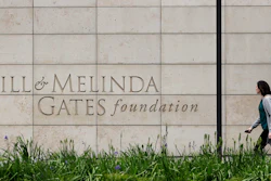 A person walks by the headquarters of the Bill and Melinda Gates Foundation on April 27, 2018, in Seattle.