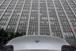 A Tesla car is parked in a lot across the street from a federal courthouse in San Francisco, Wednesday, Jan. 18, 2023.