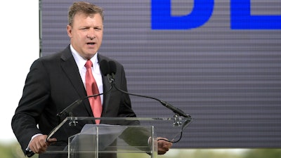 Florida Power and Light President and CEO Eric Silagy addresses reporters and guests during a news conference unveiling the new Blue Origin rocket at the Cape Canaveral Air Force Station in Cape Canaveral, Fla., Sept. 15, 2015.