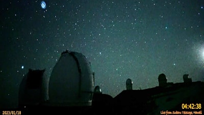 This image taken from video provided by the NAOJ & Asahi Shimbun, shows spiral swirling through the night sky from Mauna Kea, Hawaii's tallest mountain.