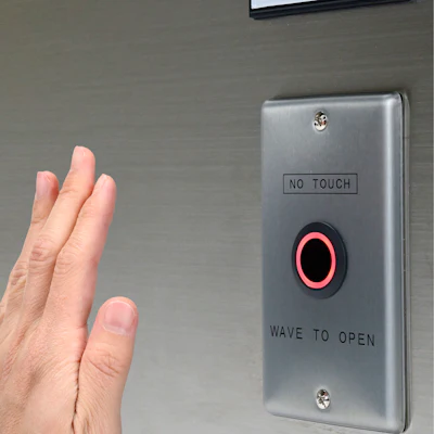 Figure 2: IDEC CW low-profile touchless switches use infrared LED diffuse reflection technology to detect a user’s hand without contact, with a two-color LED indicator ring to provide status feedback.