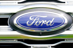 A logo on a vehicle at a Ford dealership in Springfield, Pa., Tuesday, April 26, 2022. The U.S. government’s road safety agency is investigating complaints that windshield trim panels can fly off of Ford Explorers while they’re traveling at highway speeds, Tuesday, Jan. 31, 2023. The National Highway Traffic Safety Administration says it has 164 complaints about the trim pieces detaching on 2011 through 2019 Explorer SUVs.