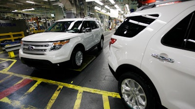 Plant employees drive 2011 Ford Explorer vehicles off the assembly line at Ford's Chicago Assembly Plant in Chicago, Dec. 1, 2010. The U.S. government's road safety agency has closed a more than six-year investigation into Ford Explorer exhaust odors, determining that the SUVs don't emit high levels of carbon monoxide and don't need to be recalled.