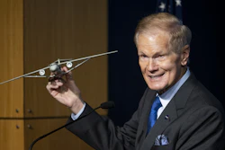 NASA Administrator Bill Nelson holds a model of an aircraft with a Transonic Truss-Braced Wing during a news conference on NASA's Sustainable Flight Demonstrator project, Wednesday, Jan. 18, 2023, at the Mary W. Jackson NASA Headquarters building in Washington, DC.