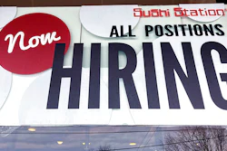 A hiring sign is displayed at a restaurant in Rolling Meadows, Ill., Tuesday, Dec. 27, 2022. On Wednesday, the Labor Department reports on job openings and labor turnover for November.