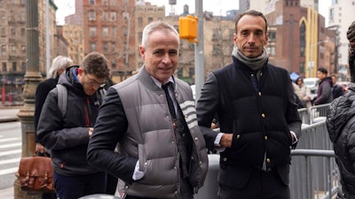 Fashion designer Thom Browne waits in line outside Manhattan federal court, Monday, Jan. 9, 2023, in New York.