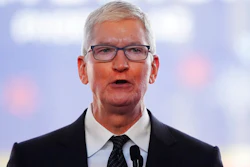 Apple CEO Tim Cook speaks in front of the new Taiwan Semiconductor Manufacturing Company facility under construction in Phoenix, Tuesday, Dec. 6, 2022. Cook will take a more than 40% pay cut this year from a year earlier as the company adjusts how it calculates his compensation. Apple Inc. said in a regulatory filing that Cook’s target total compensation is $49 million for 2023.