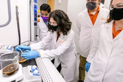 The authors with two students show methods for recycling bio-based foam.