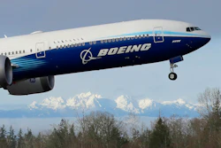 In this Jan. 25, 2020, file photo a Boeing 777X airplane takes off on its first flight with the Olympic Mountains in the background at Paine Field in Everett, Wash.