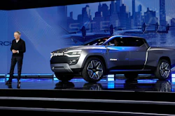 Stellantis CEO Carlos Tavares stands beside the Ram 1500 Revolution electric battery powered pickup truck during the CES tech show Thursday, Jan. 5, 2023, in Las Vegas.