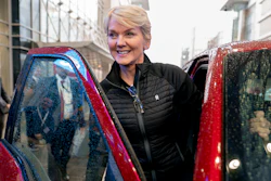 Energy Secretary Jennifer Granholm gets into the passenger seat after test driving a Ford F-150 Lighting all electric vehicle during a visit to the Washington Auto Show in Washington, Wednesday, Jan. 25, 2023.
