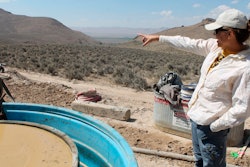 In this Sept. 13, 2018, file photo, Melissa Boerst, a Lithium Nevada Corp. geologist, points to an area of future exploration from a drill site at the Thacker Pass Project in Humboldt County, Nev.