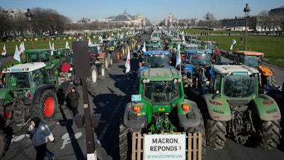 Tractors park in front of the Grand Palais museum on the Esplanade des Invalides, Paris, Feb. 8, 2023.