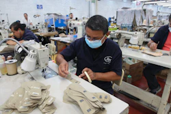 A man works in a shoe maquiladora or factory, in Leon, Mexico, Monday, Feb. 7, 2023.