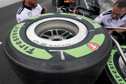 Tires made from natural rubber derived from a desert shrub, sit on a cart before the pit stop contest ahead of the Indianapolis 500 auto race at Indianapolis Motor Speedway, Friday, May 27, 2022, in Indianapolis.