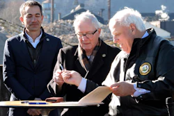 West Virginia Gov. Jim Justice, right, hands a pen used to sign House Bill 2882 to Weirton Mayor Harold 'Bubba' Miller, while Form Energy CEO Mateo Jaramillo watches.