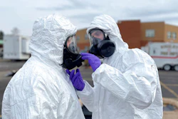 This photo provided by the Ohio National Guard, ONG 52nd Civil Support Team members prepare to enter an incident area to assess remaining hazards with a lightweight inflatable decontamination system (LIDS) in East Palestine, Ohio, Tuesday, Feb. 7, 2023. Authorities say air monitoring hasn’t detected dangerous levels of fumes in communities where crews released and burned toxic chemicals from a derailed train. But they said Tuesday that Ohio and Pennsylvania residents living close to the wreckage still aren’t being allowed in their homes.