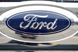 In this Sunday, Oct. 20, 2019, photograph, the company logo shines off the grille of an unsold 2019 F-250 pickup truck at a Ford dealership in Littleton, Colo. Ford reports financial earnings on Thursday, Feb. 2, 2023.